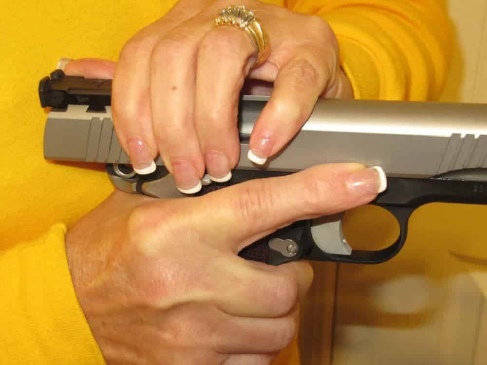WRONG: Do NOT Place Support Fingers or Hand Over Ejection Port When Racking Slide