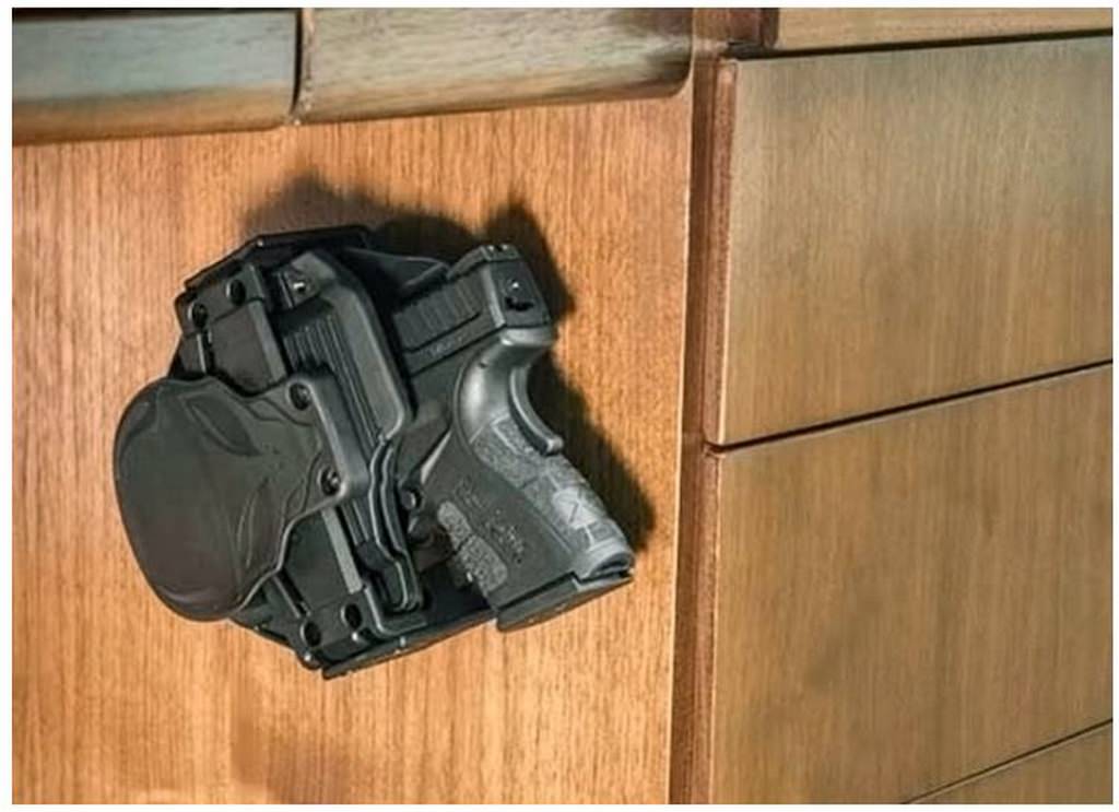 Cloak Mod OWB Holster and Gun Fits in the Cloak Dock Mounting Bracket Attached to Desk