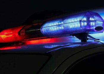 Security Guard Fires While in a Headlock, Killing Attacker; Wounding a Bystander