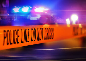 Wife Hit During an Exchange of Gunfire Between Intruder and Homeowner; Police Find Suspect Hiding Inside Home