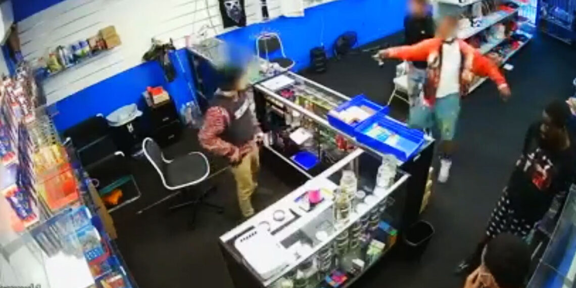Watch Shootout Between Smoke Shop Employee and 4 Armed Robbers