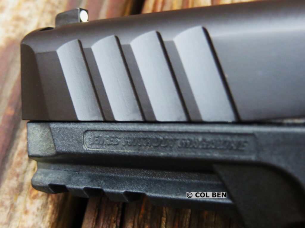 Stoeger STR-9C Compact 9mm Pistol: Review & Field Test 2 Slide Serrations, Accessory Rail, & Steel Guide Rod on the STR-9 Compact