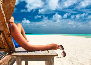 Man Cleaning Sand from Gun Negligently Shoots Woman on Beach