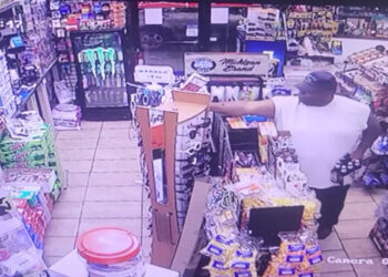 Concealed Carrier Holding 6-Pack of Beer Shoots Armed Robber