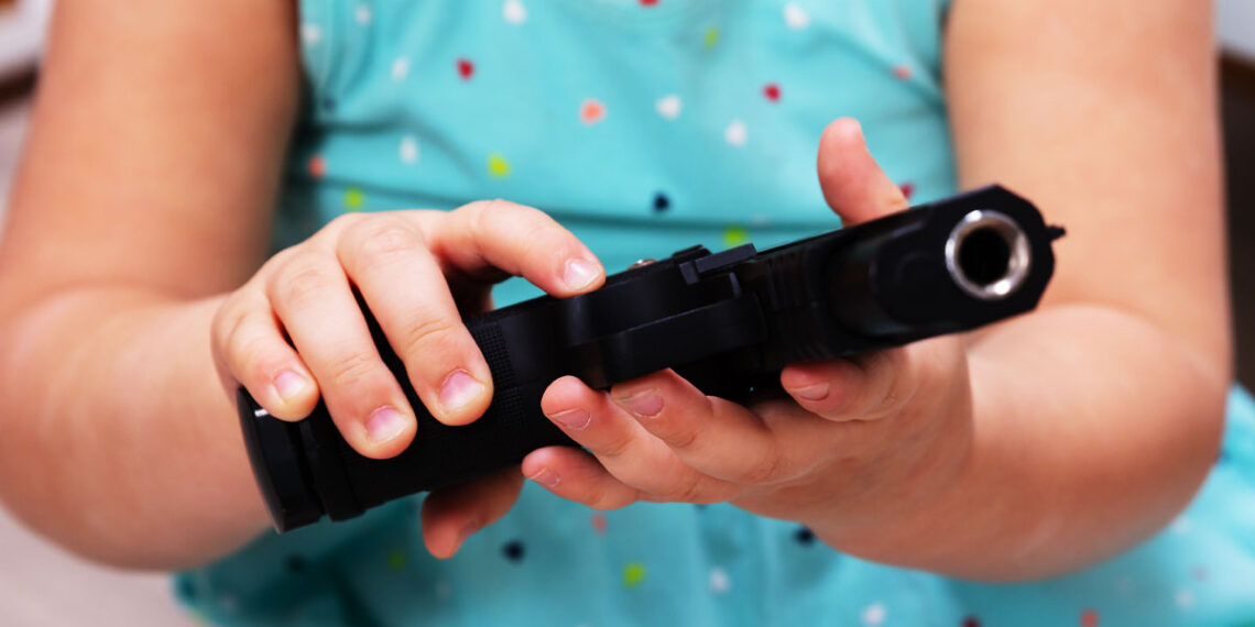 Man Arrested After Toddler Shoots Himself with Handgun Left on Bed
