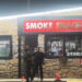 Armed Robber Shoots Fayetteville Smoke Shop Clerk, Steals His Gun and Runs